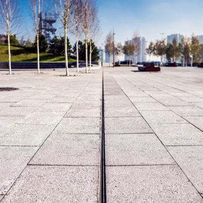 SLOTTED CHANNEL installed within public space surface