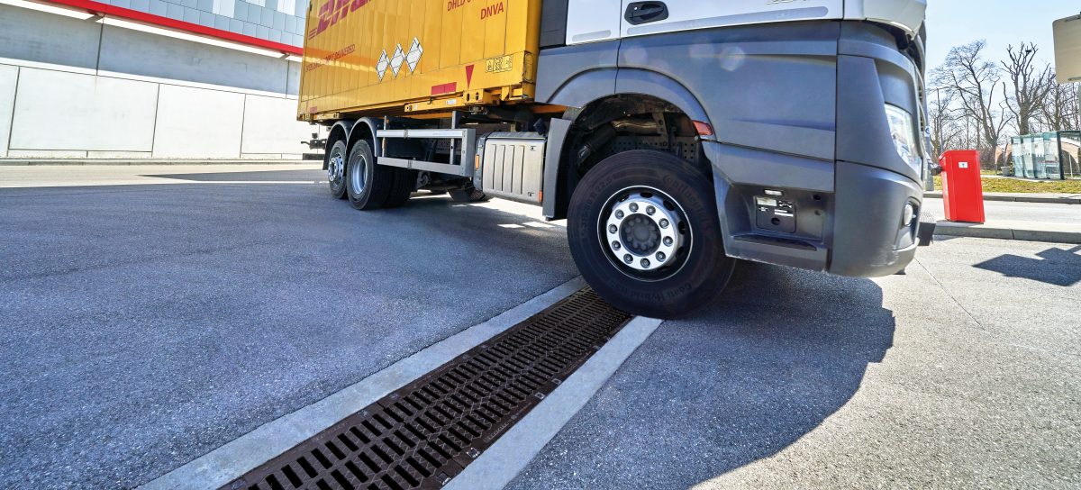 Heavy-duty drainage channel trafficked by transportation lorry